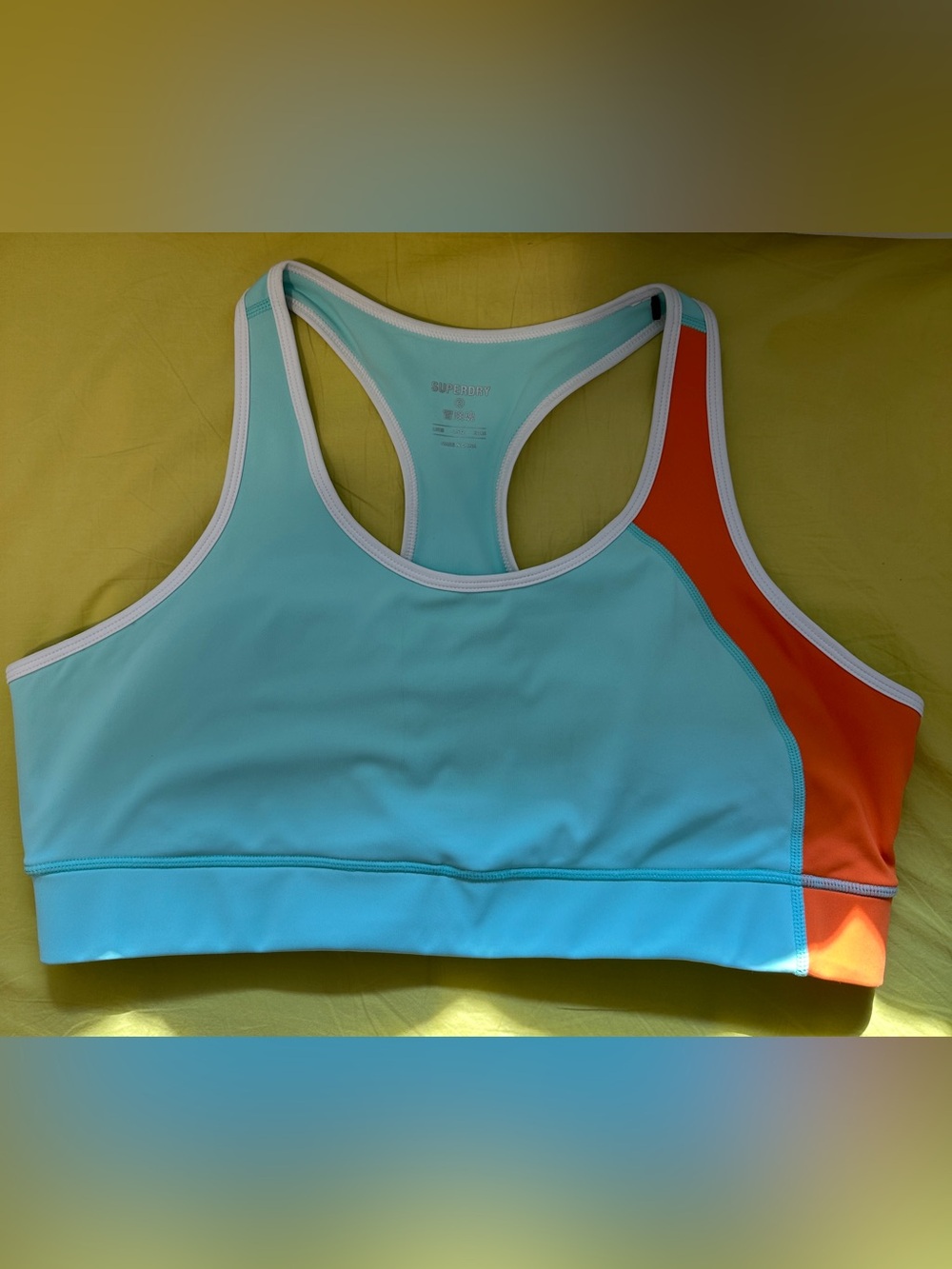 Superdry Aqua Sports Bra with Orange Side and white Panel